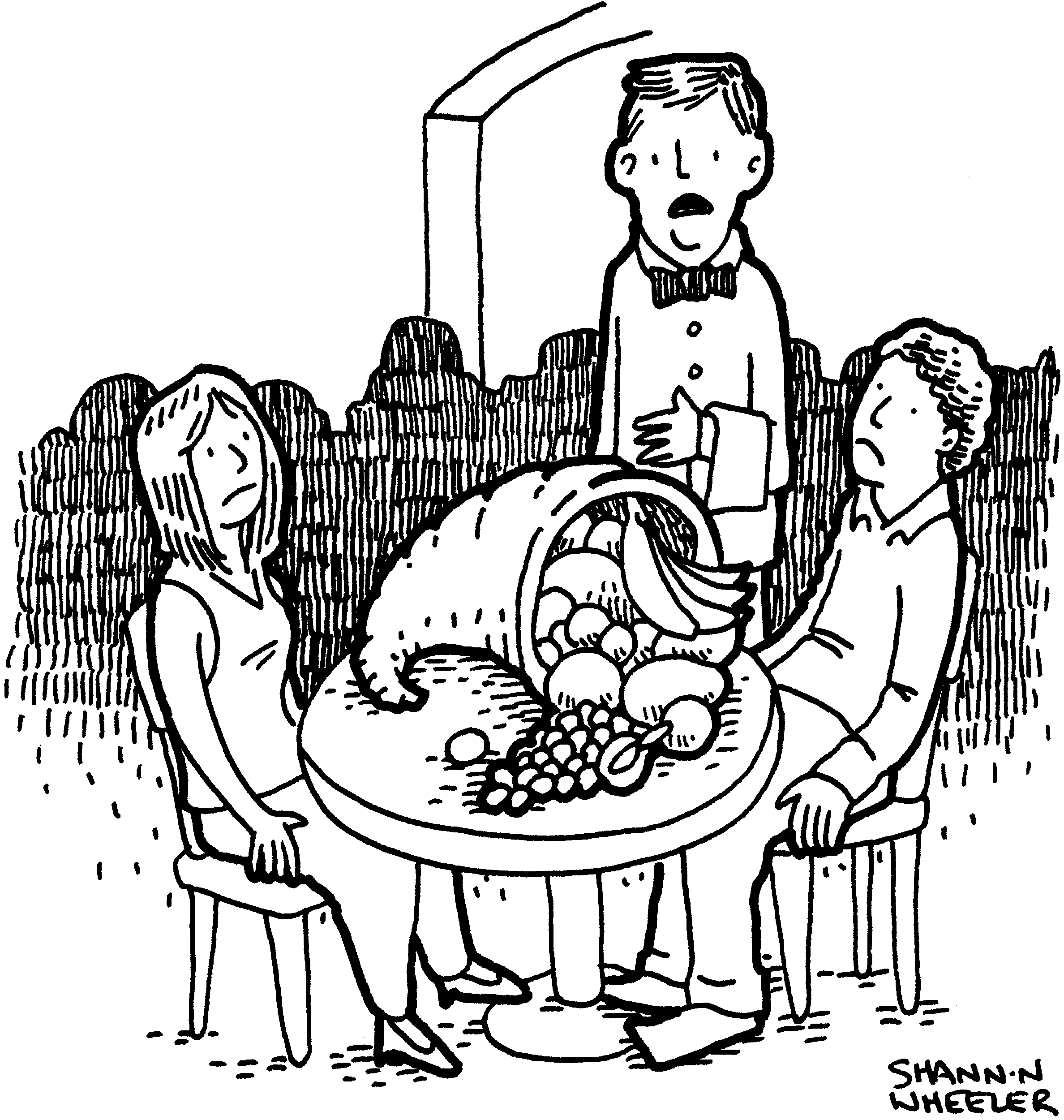 Two people sitting at a table that is topped with a cornucopia 