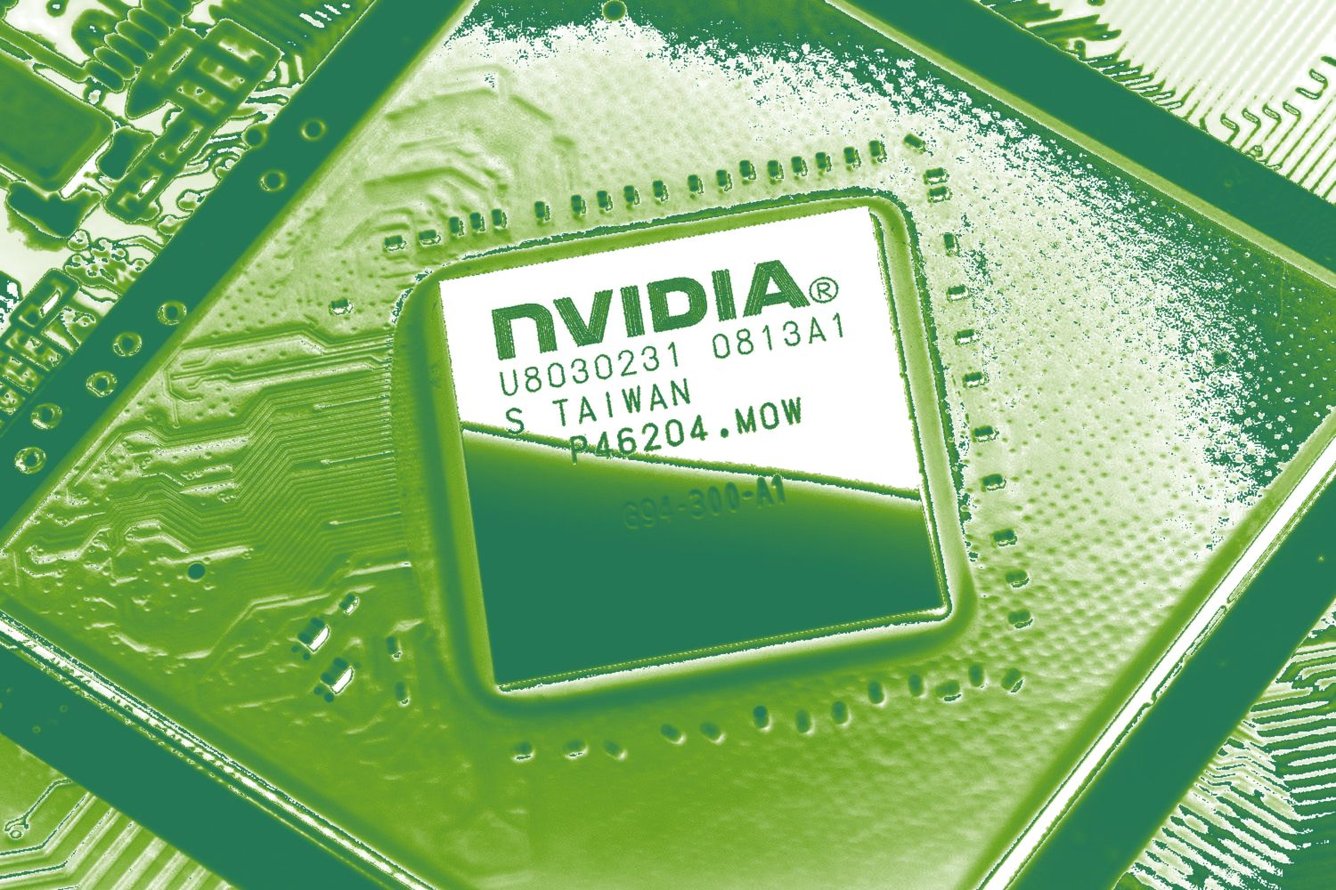 Close-up photo of an Nvidia computer chip with a gradient map applied, colorizing it to be vibrant shades of green.