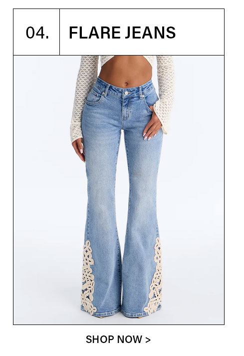Women's light wash flare denim jeans with intricate cream lace cutouts.