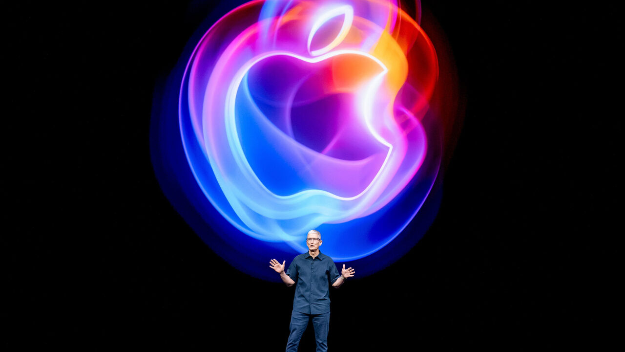 Tim Cook speaks on stage during an Apple event.