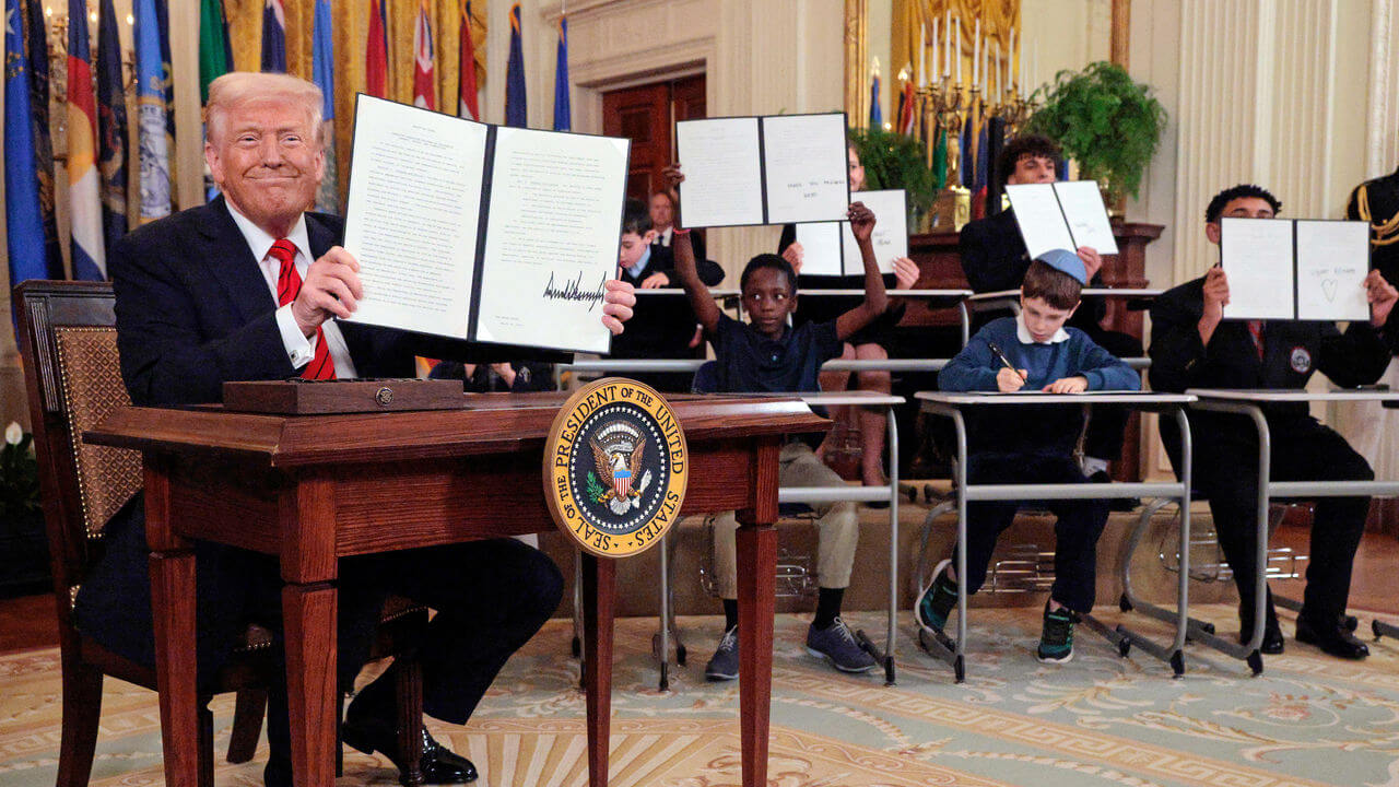 President Trump signs an executive order to reduce the size and scope of the Department Of Education.