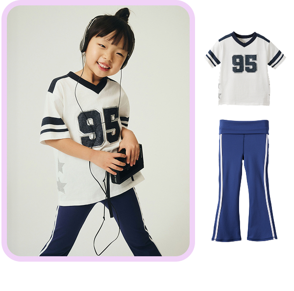 Child wearing sports jersey with number 95 and blue and white striped pants