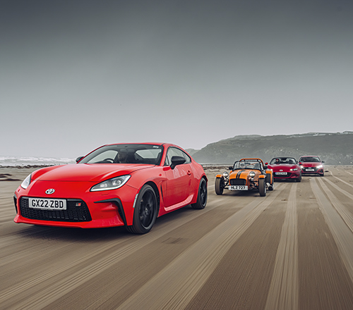 Procession of red cars