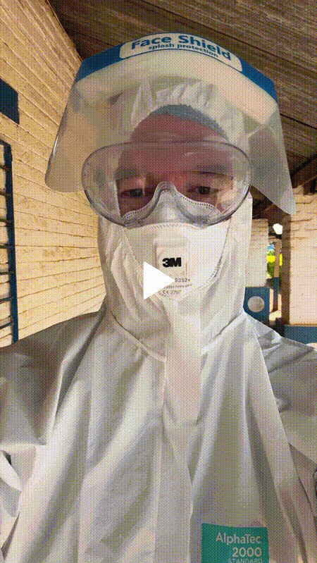 A short video of Declan Walsh, a reporter, wearing protective clothing and walking through a building.