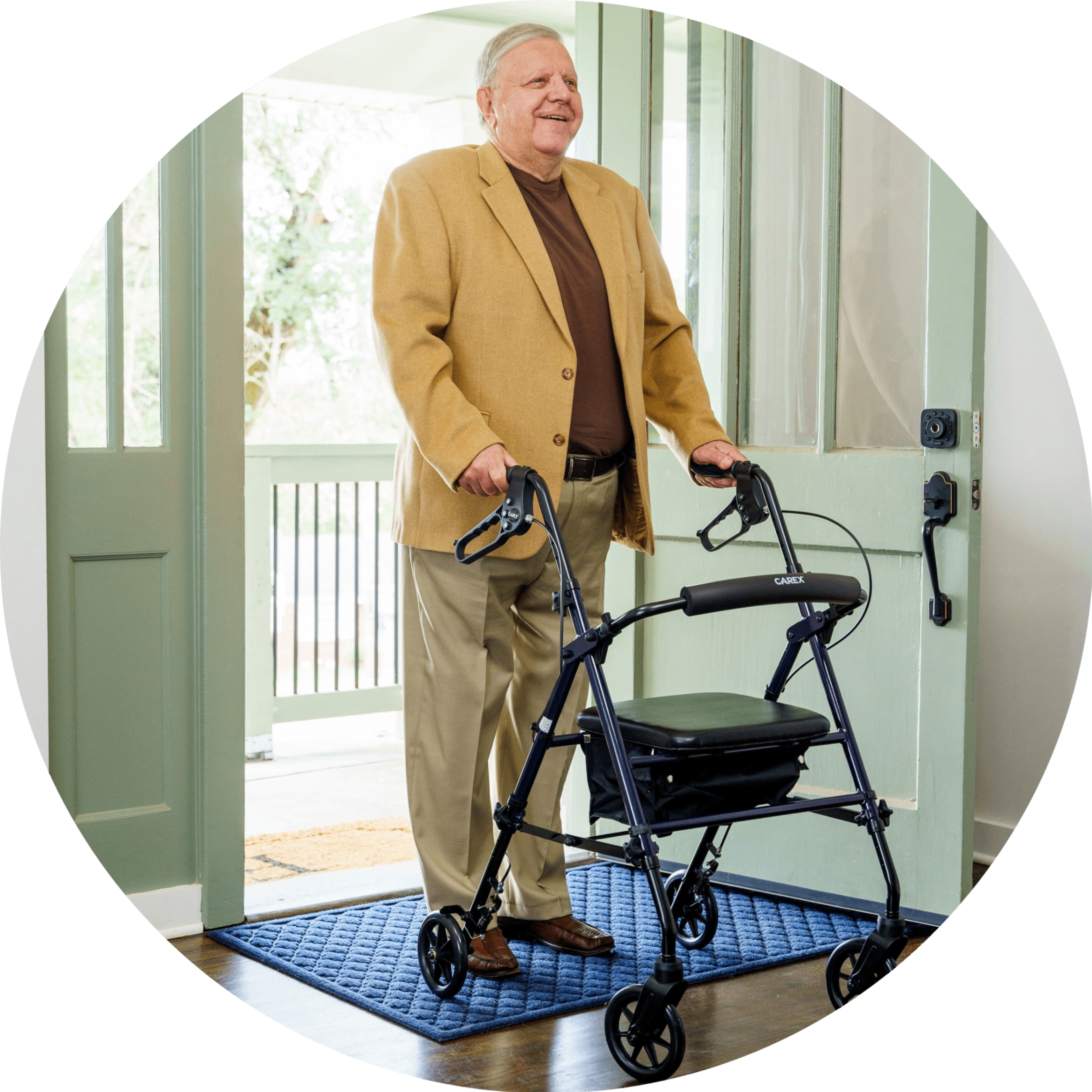An elderly man walking with the Step 'n Rest Rollator