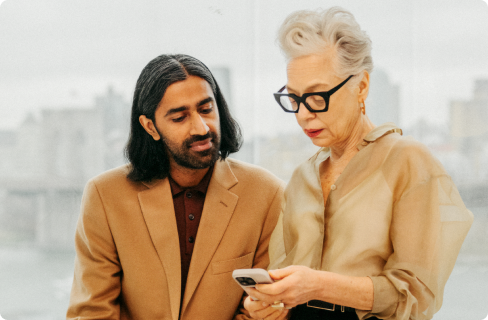 Photo-of-coworkers-focused-on-phone