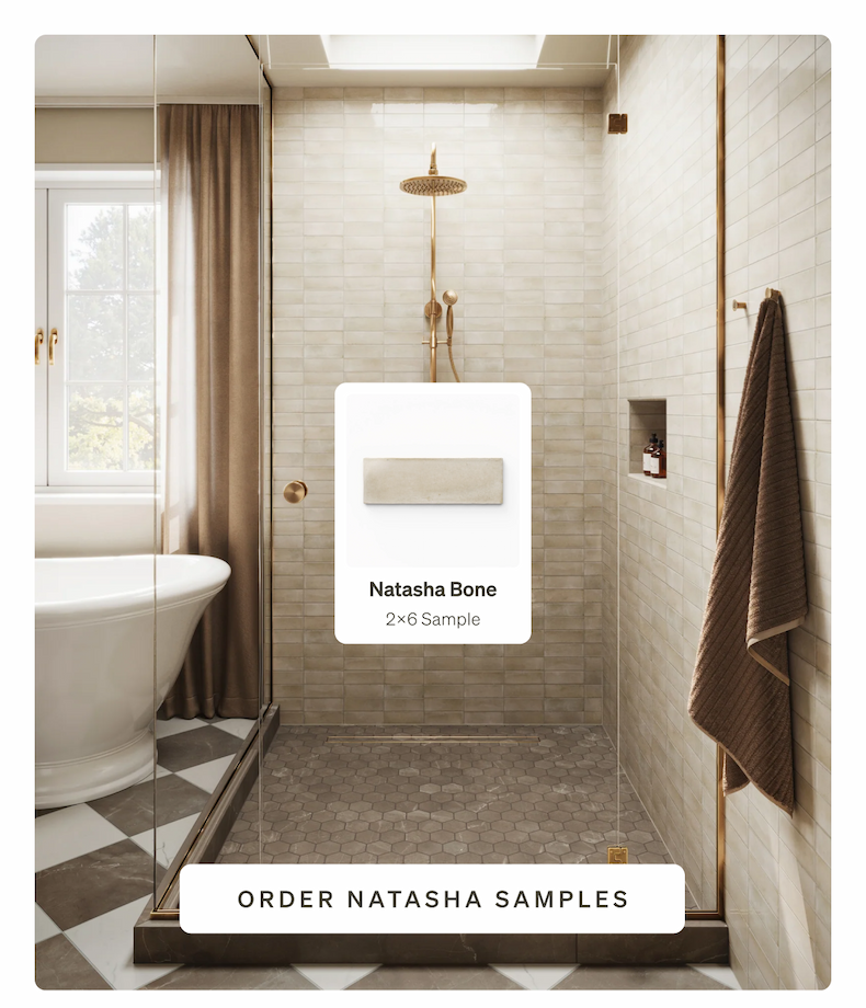 A luxurious shower tiled in rectangular Natasha Bone tiles with gold fixtures, a freestanding tub.
