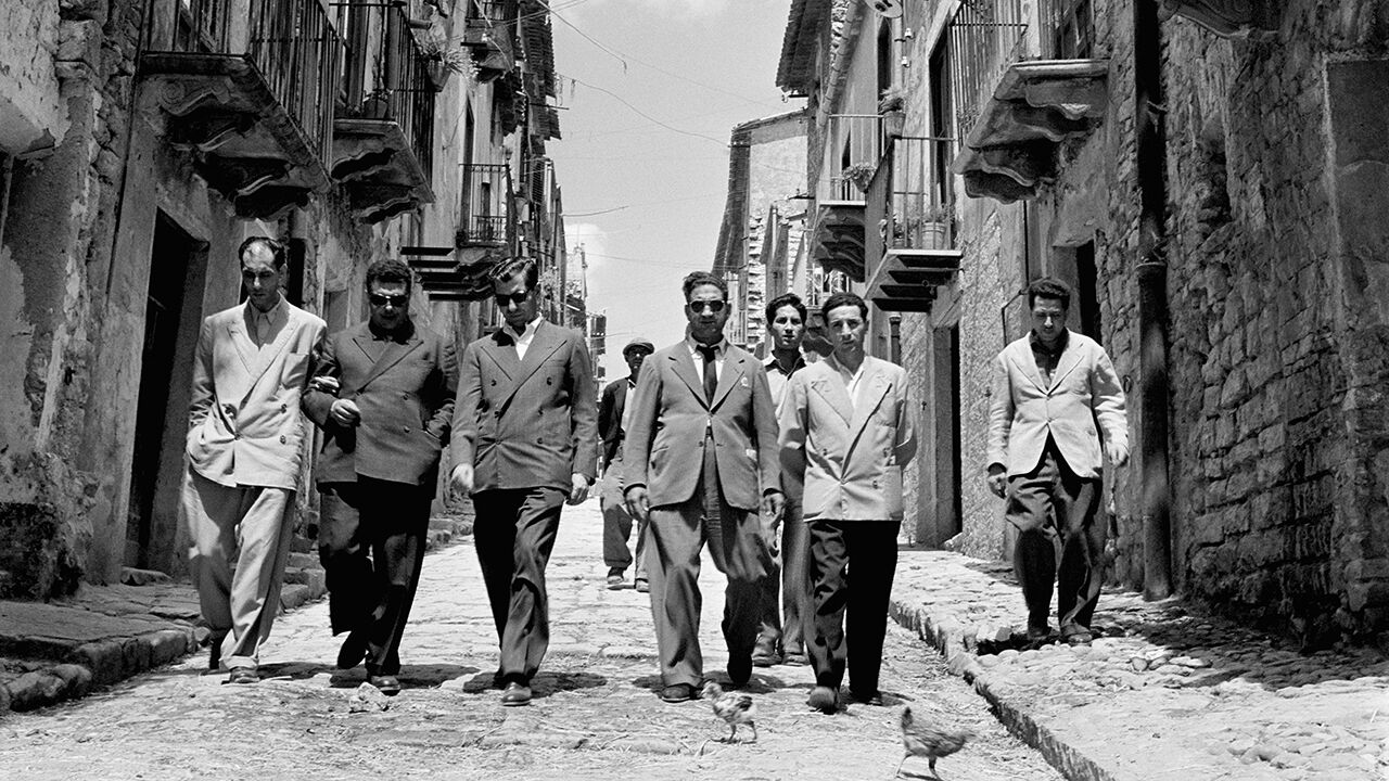 Mafia boss Charles 'Lucky' Luciano (third right) walking with his henchmen in Sicily, Italy,