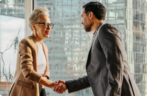 Photo-of-two-coworkers-shaking-hands-in-office