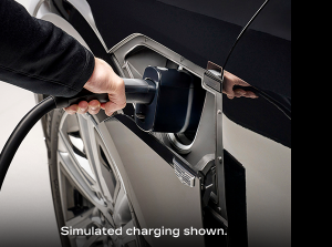 Charging cord being inserted with disclaimer “Simulated charging shown.”