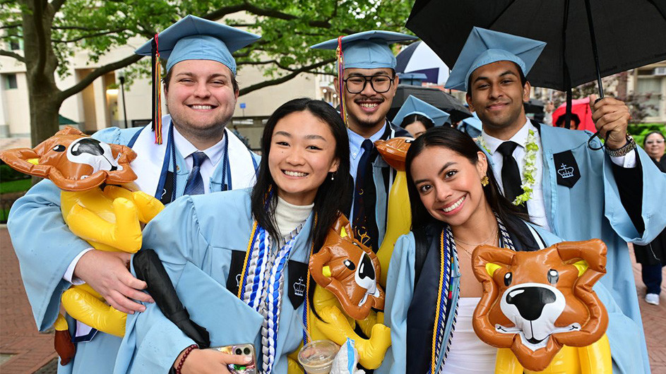 Five graduates pose on Morningside campus beofre 2025 commencement
