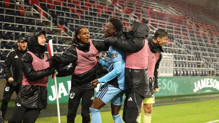 Darius Randell celebrates with teammates after scoring in St. Louis