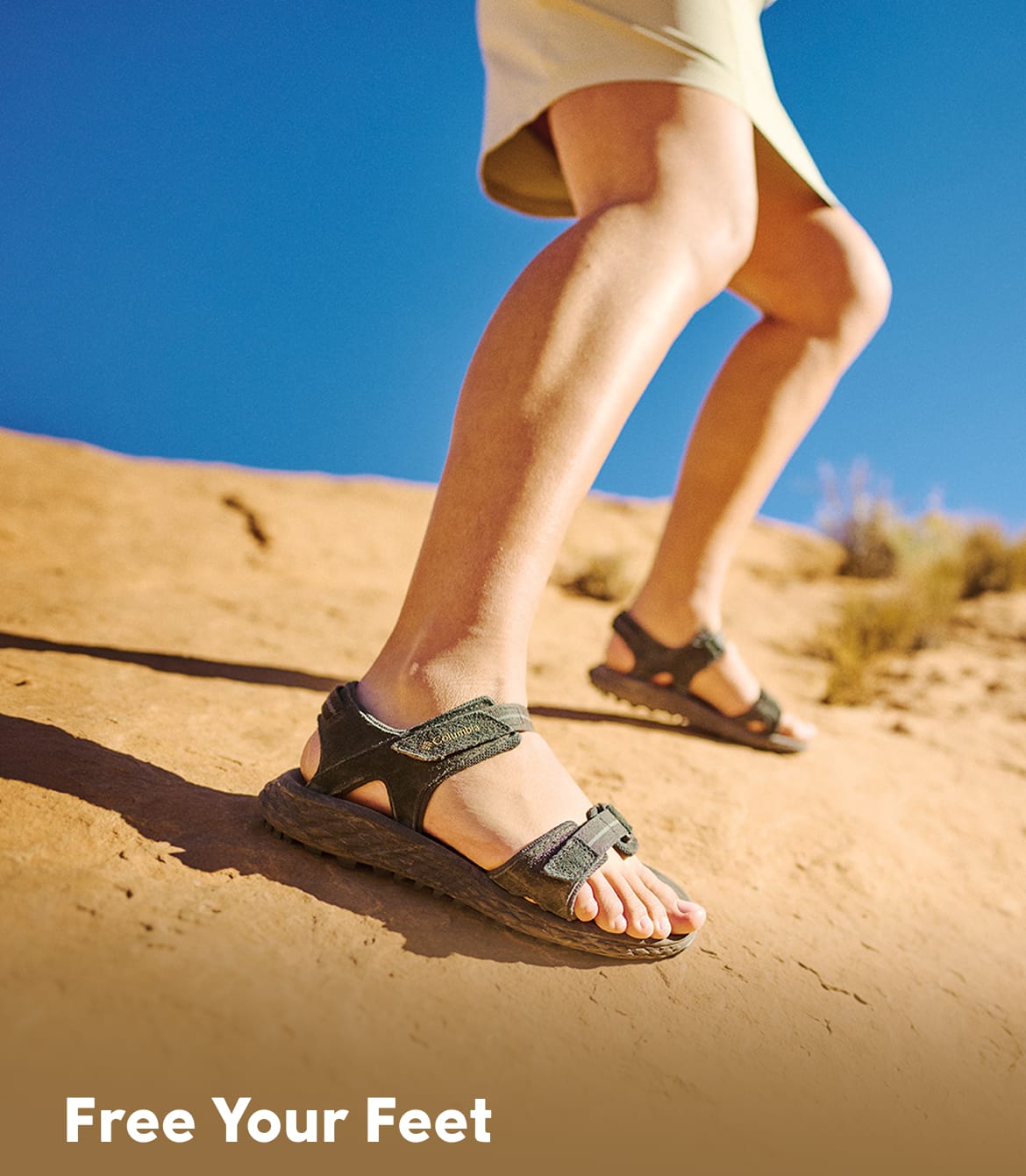 A person wearing sandals with text that says Free Your Feet