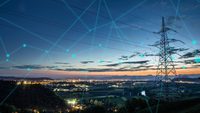 view of landscape and power lines at night, with blue dots and lines