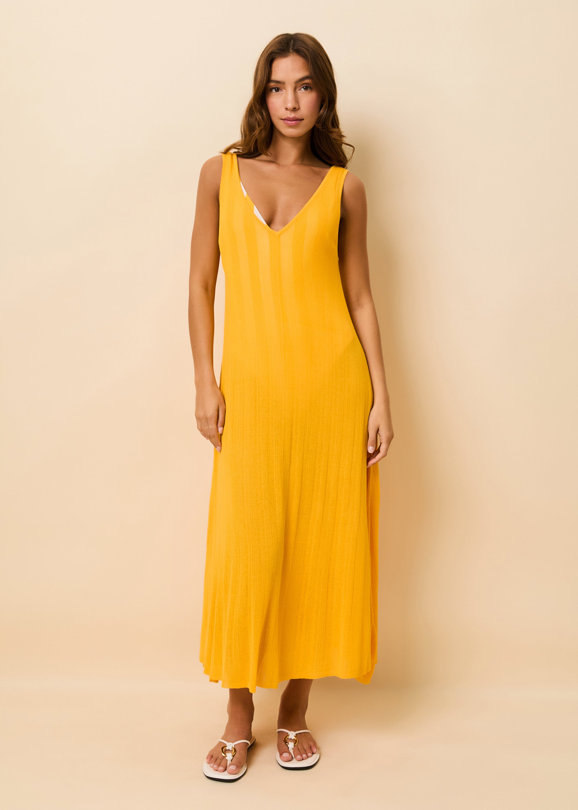 Woman in a lightweight knit yellow cover up dress
