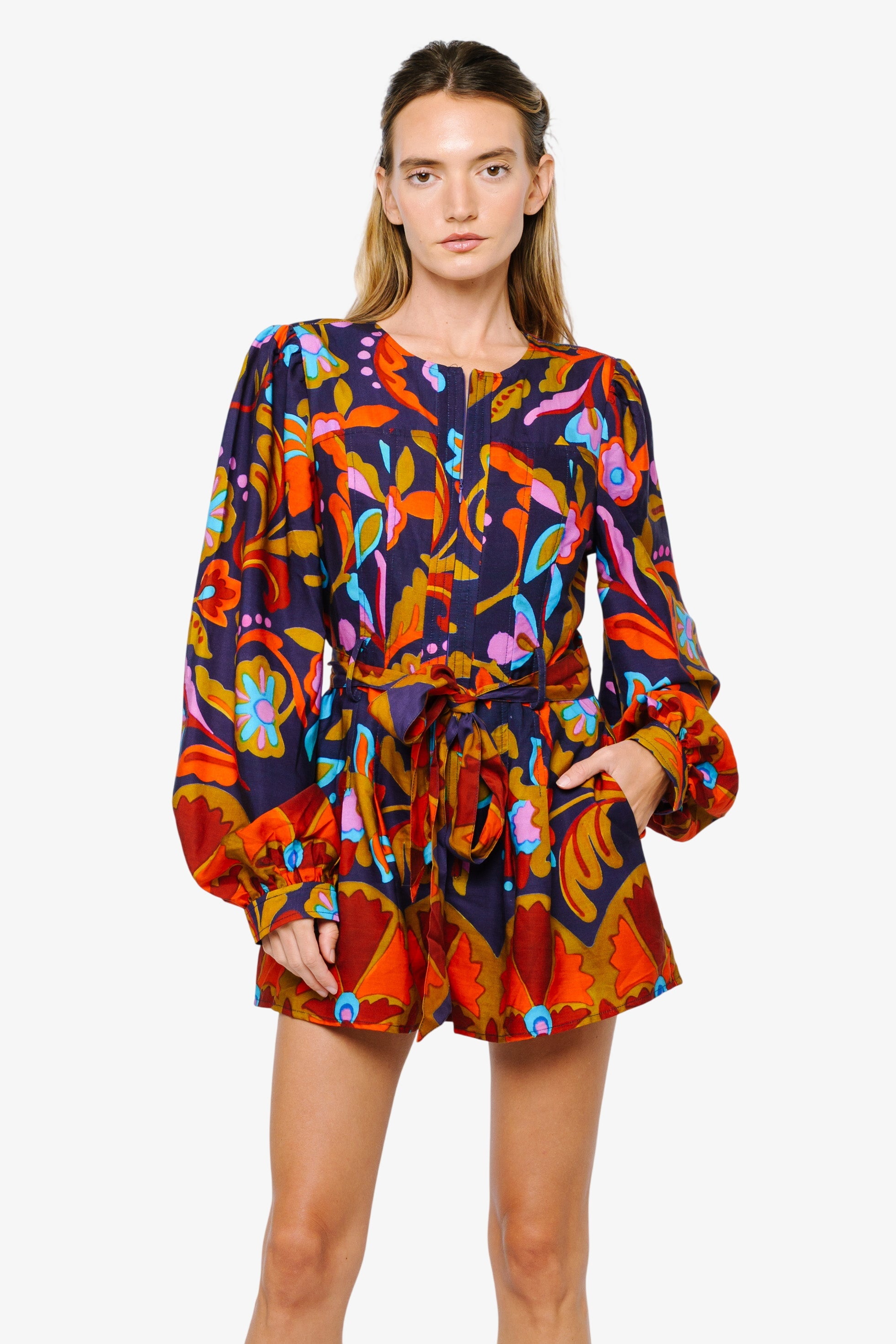 woman wearing a floral print romper