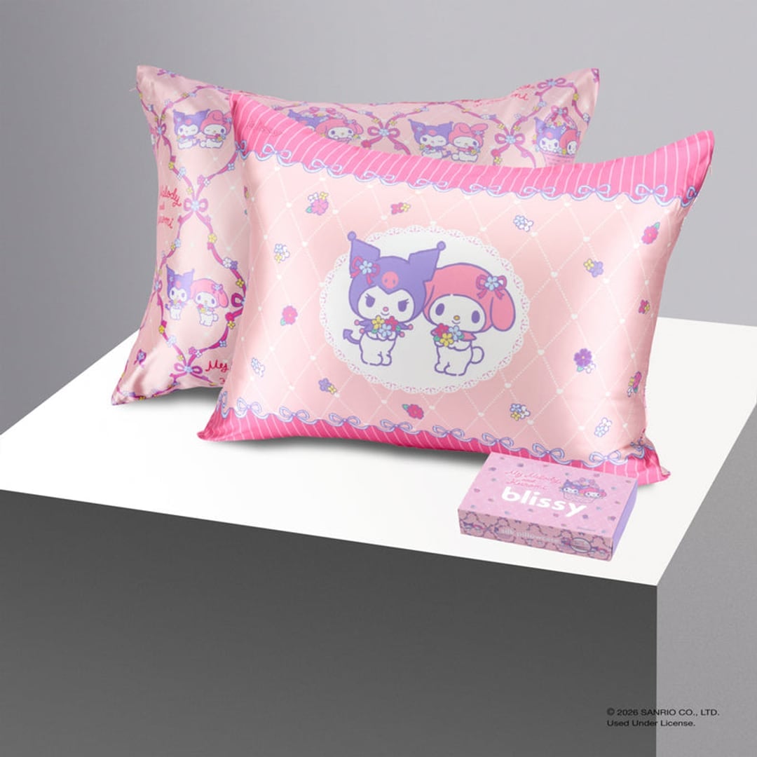 The double-sided My Melody and Kuromi silk pillowcase — the character cameo on one side, a basket-and-ribbon print on the other