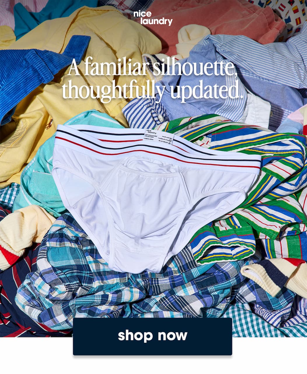 A huge pile of various clothing and patterned underwear with a pair of white briefs on the top. Text overlay is "a familiar silhouette thoughtfully updated"