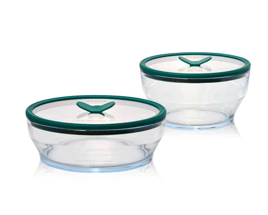 The Anyday Everything Dish Large Starter Set, a plastic-free glass storage and cooking set with kale-green lids. This versatile set includes a range of sizes for meal prep, leftovers, and microwave cooking, designed for airtight and stackable storage.