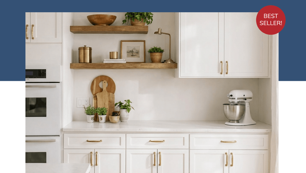 Best Seller: Weston White Shaker. Kitchen with white cabinets with gold pulls, and some wooden floating shelves.