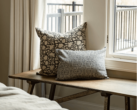 Neutral pillows add a primary bedroom