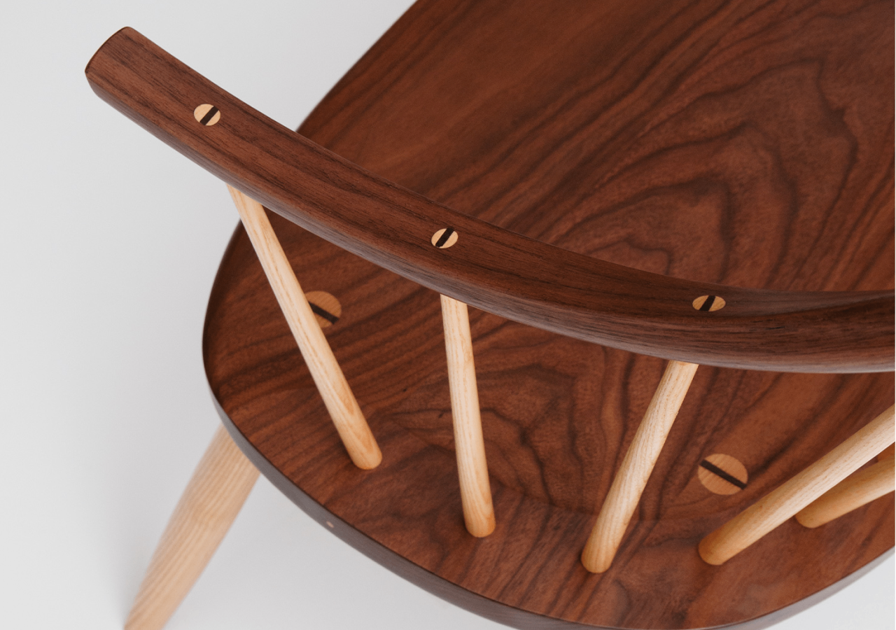 Detail of the continuous arm bench which shows the wedged tenon.
