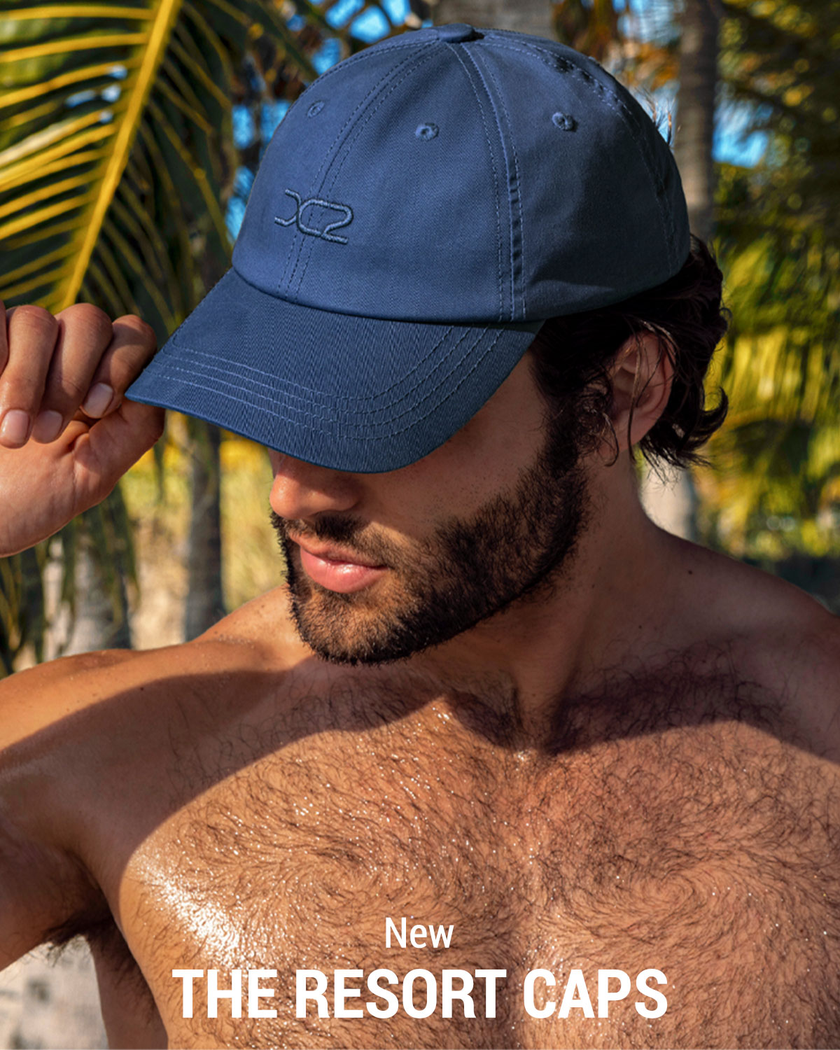 NEW - Resort Caps — model wearing the navy blue DC2 Resort Cap with embroidered DC2 logo.
