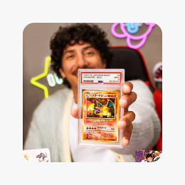 A seller holds a graded holographic Charizard Pokémon card.