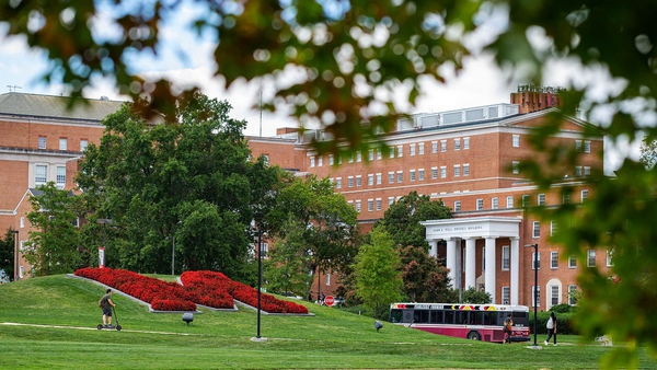red flower M with physics building in background