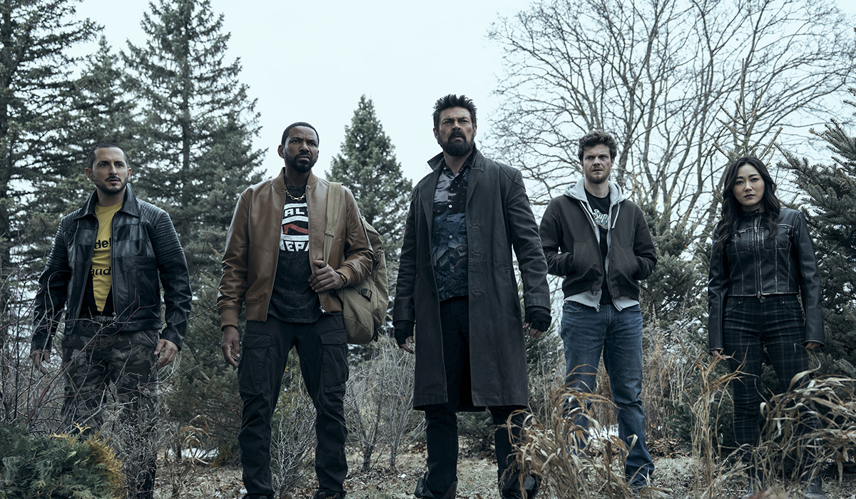 Four men and a woman pose.