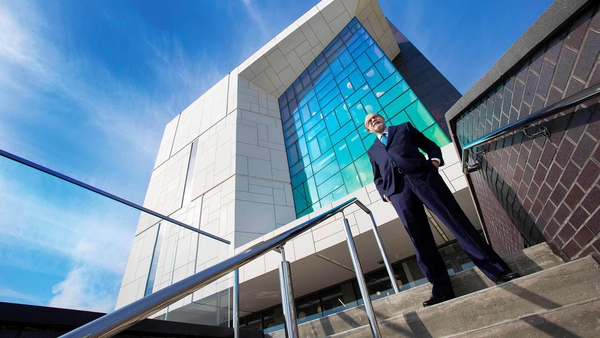 Emilio A. Fernandez stands outside E.A. Fernandez IDEA Factory