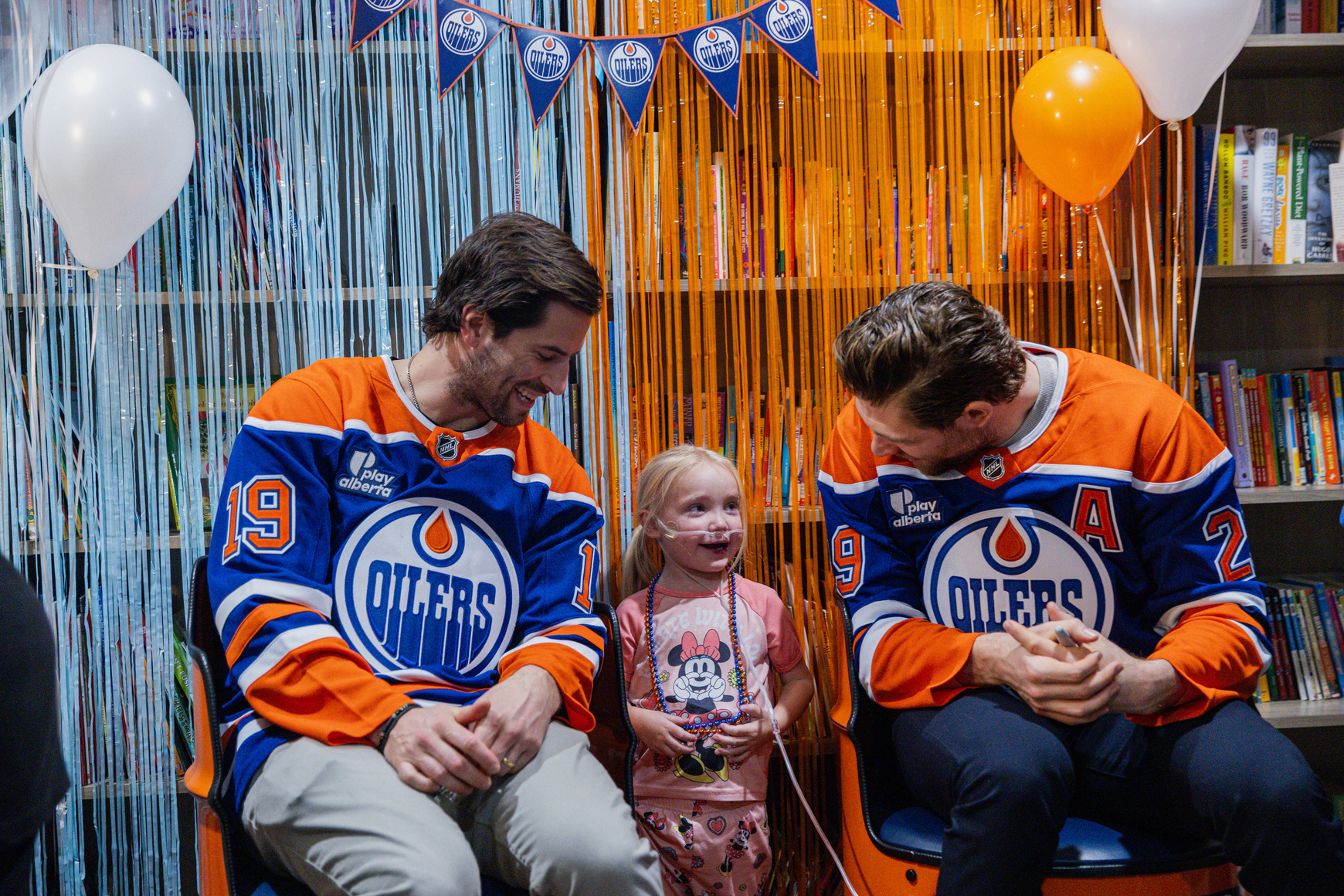 Leon & Henrique with a kid