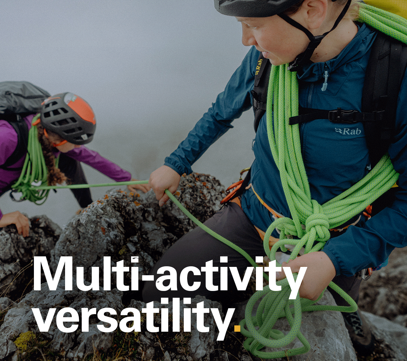 'Multi-activity versatility.' Text over the image of a women mid climb wearing Rab clothing.
