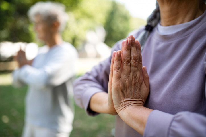 close up a
woman's hands while doing tai chi