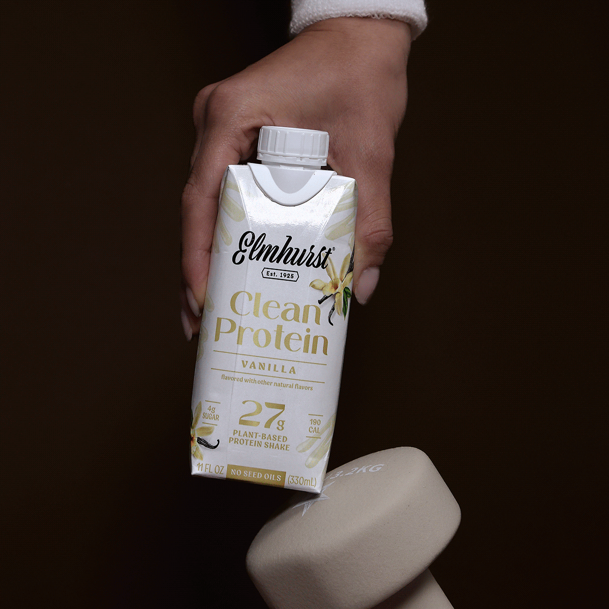 Animation showcasing Elmhurst 1925 Clean Protein shakes in Pistachio Crème, Vanilla, Sea Salt Chocolate, and Strawberries & Cream flavors, each featuring 27g of plant-based protein and no seed oils
