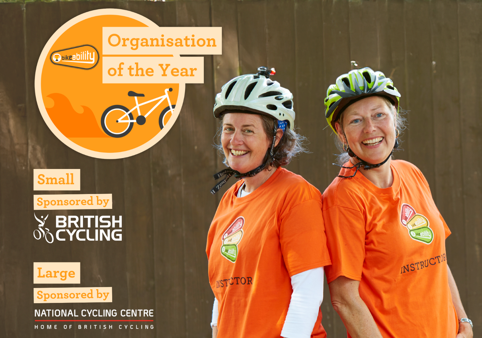Two cycle instructors wearing helmets, with wording of 'Organisation of the year'