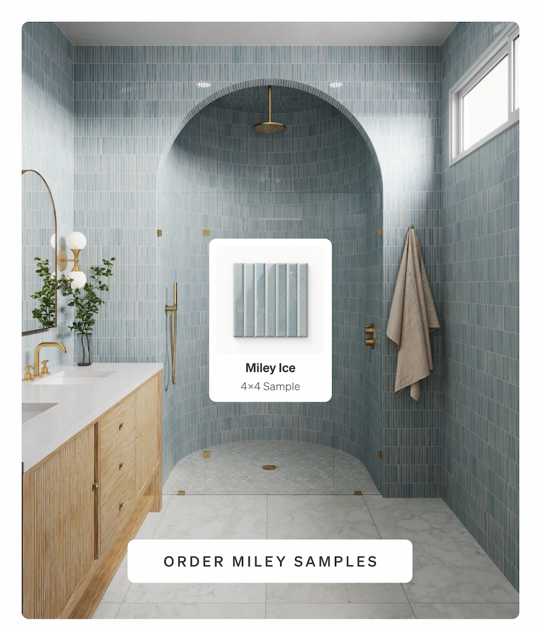 A modern bathroom featuring a curved shower arch tiled in light blue vertical Miley Ice tiles, a wooden vanity.