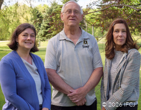 Two IFCJ staff members with Leon, an IFCJ donor.