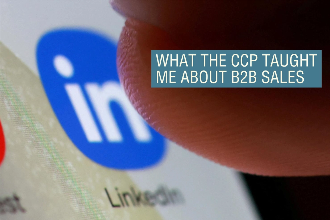 A person pressing a LinkedIn app. 