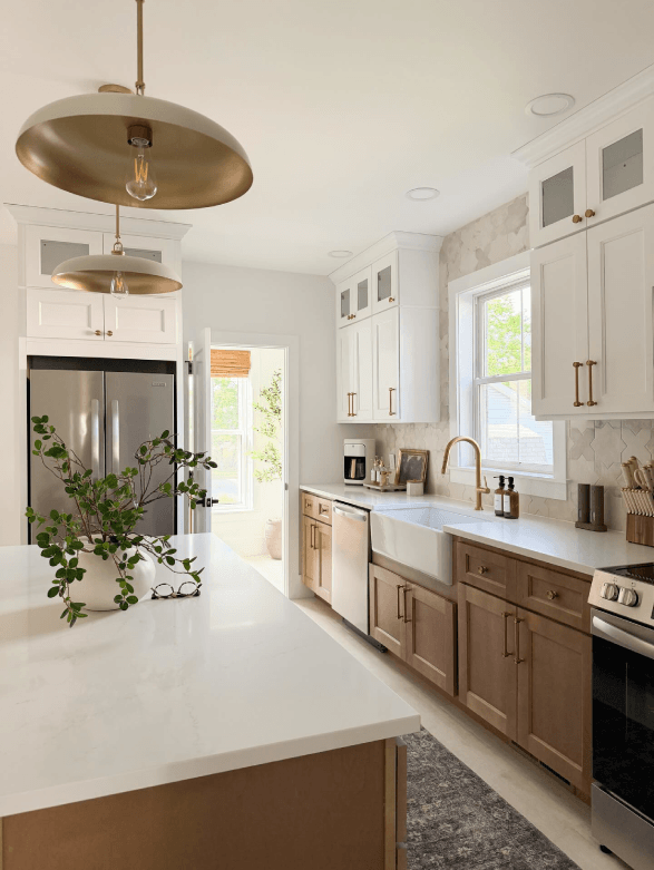 Modern kitchen with white and wood cabinets.