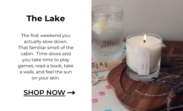image of The Lake candle burning with scenes for a Scrabble game nearby