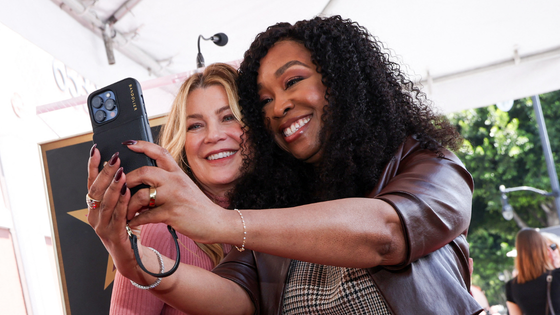 Two women pose for a selfie.