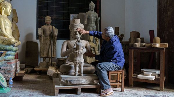 Former looter Lion with the statue of Shiva and Skanda that he looted in the 90' within the Koh Ker complex. 