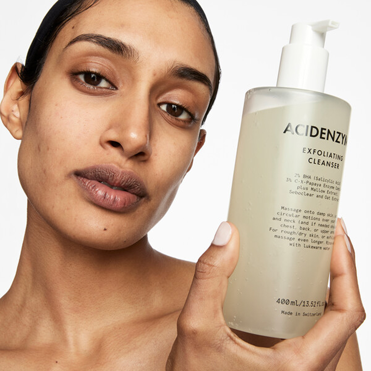 Model holding Acidenzyme cleanser