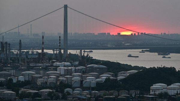 A general view of the crude oil refinery Sinopec Jinling Petrochemical Plant and Yangtze river during sunset in Nanjing, in China's eastern Jiangsu province.