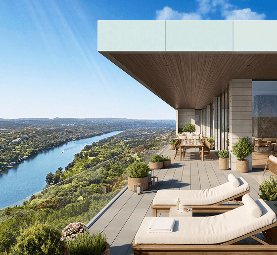 Private terrace with sweeping lake views and outdoor lounge seating.