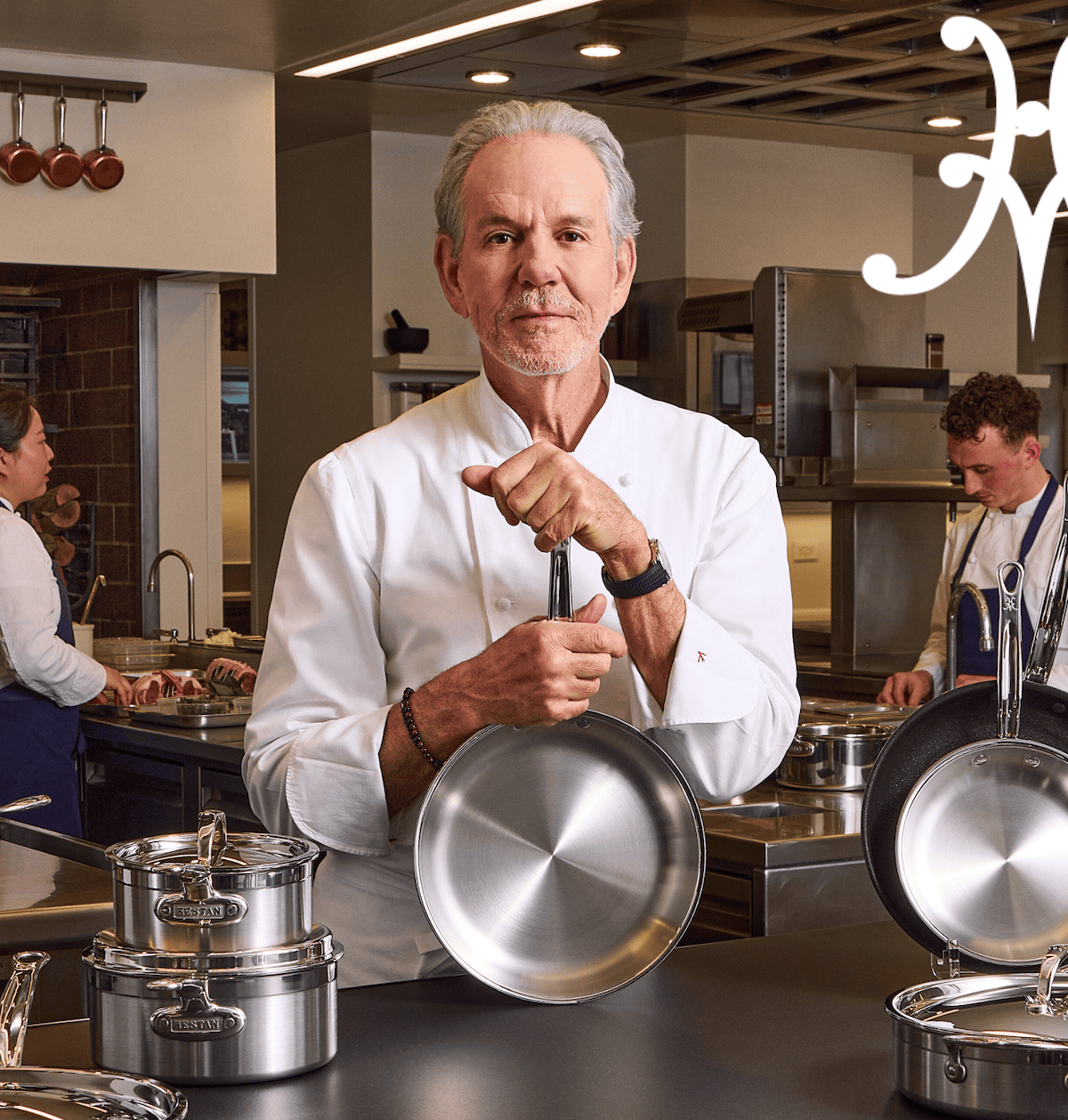 Chef Thomas Keller in the kitchen at The French Laundry showcasing the ProBond Forged collection alongside chef team.