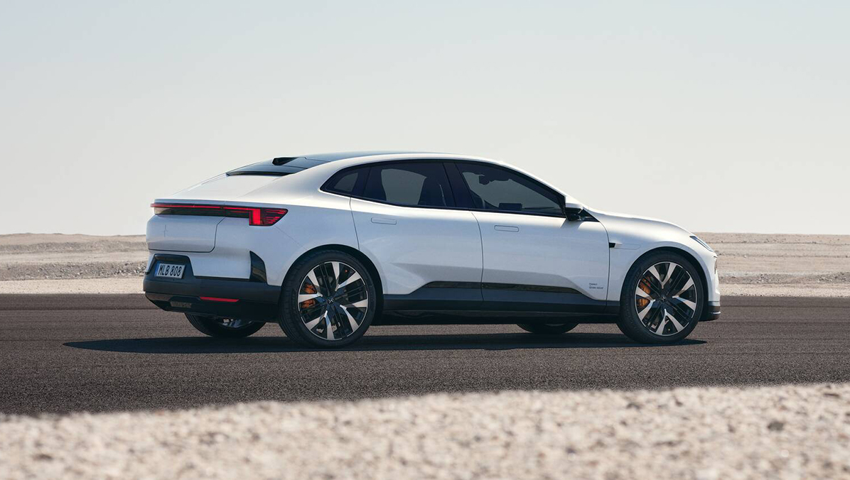 Side view of Polestar 4 driving in an open landscape.
