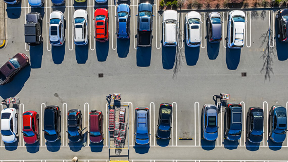 Aerial view of a parking lot with few open spaces