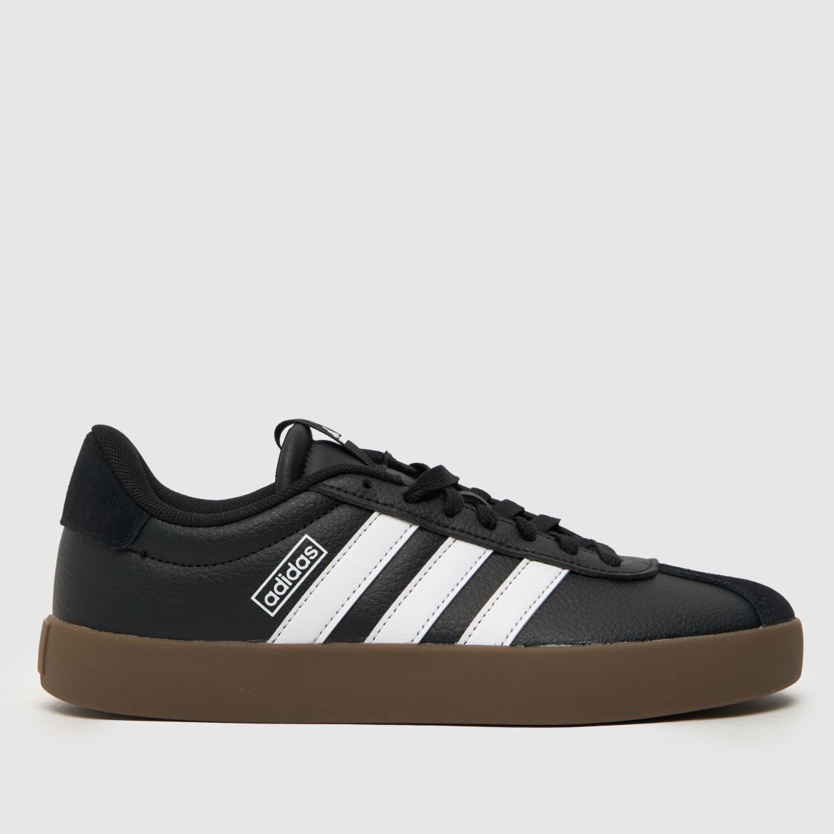 An image of a black and white adidas trainer
